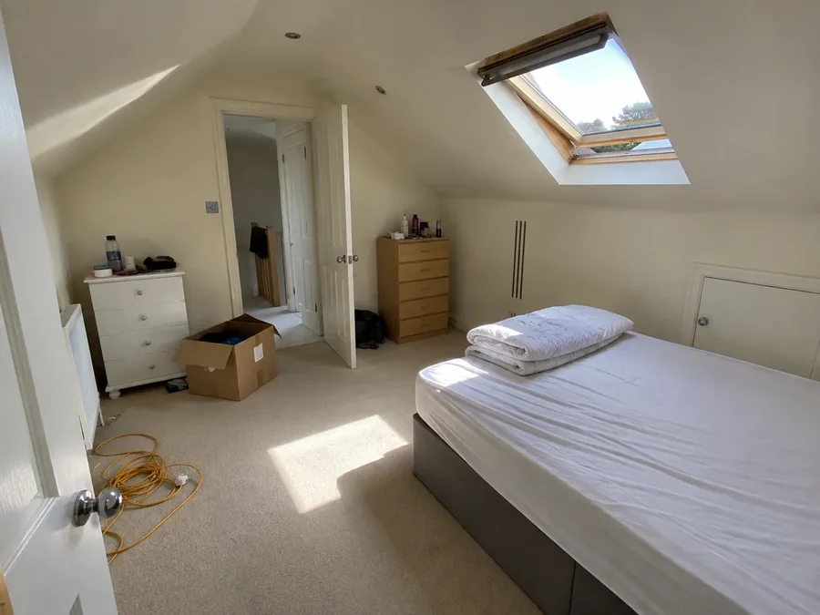 Attic room on moving-in day, boxes still out, air conditioning already fitted