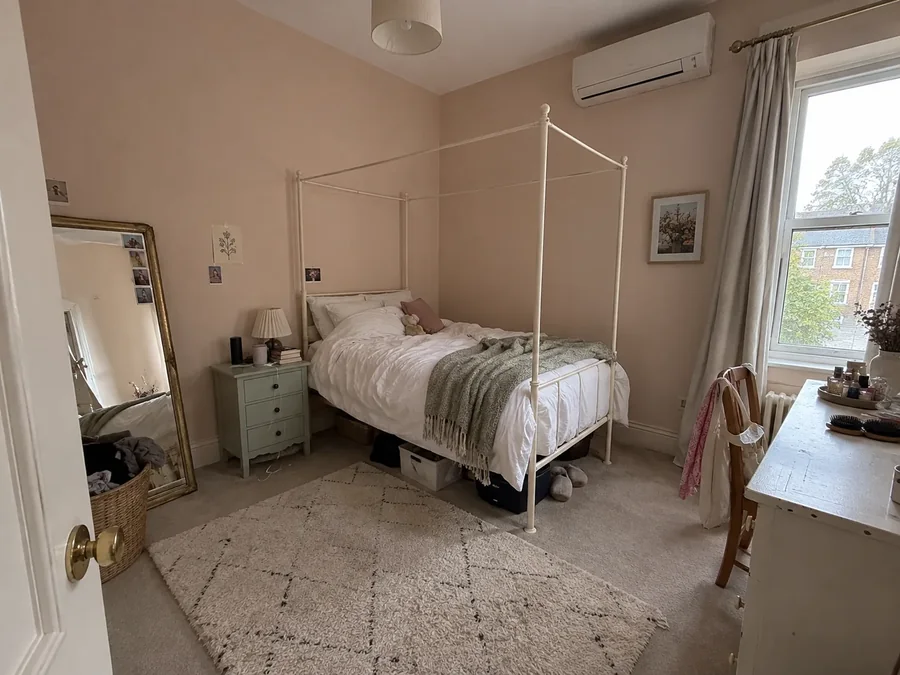 Bedroom with a four-poster bed and the air conditioning fitted