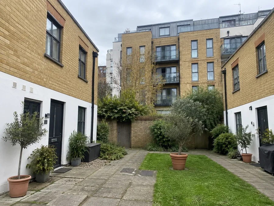 Modern brick houses around a planted courtyard