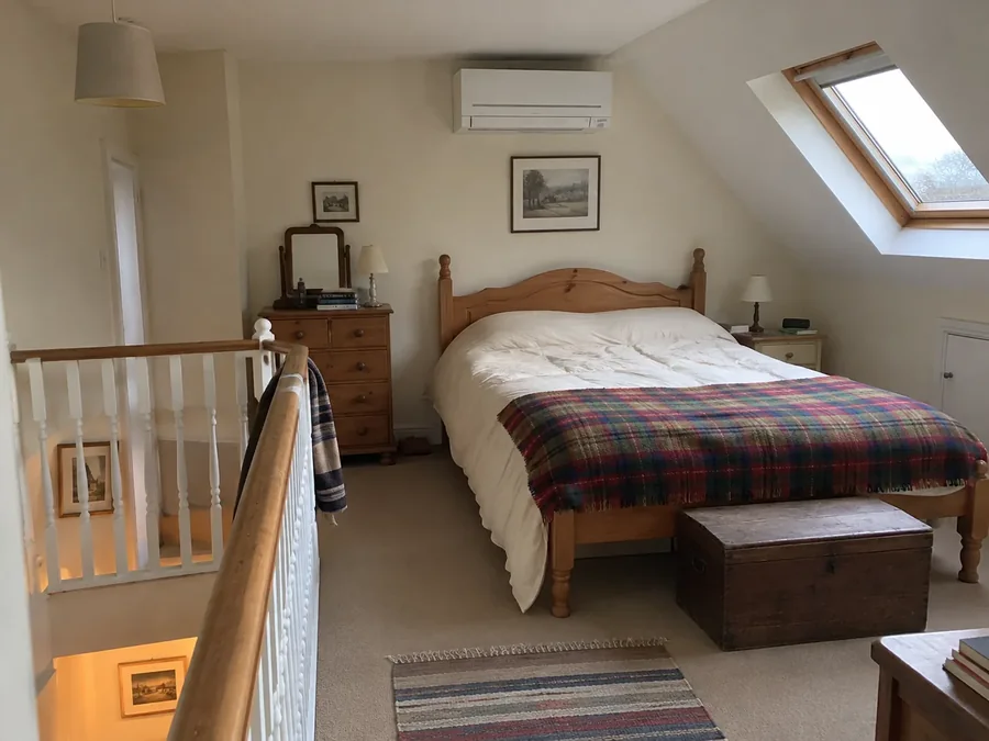 Loft bedroom beside the stair landing with the air conditioning fitted