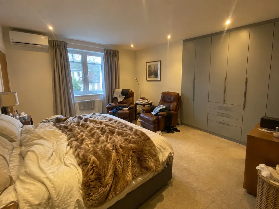Bedroom with fitted wardrobes and the air conditioning fitted