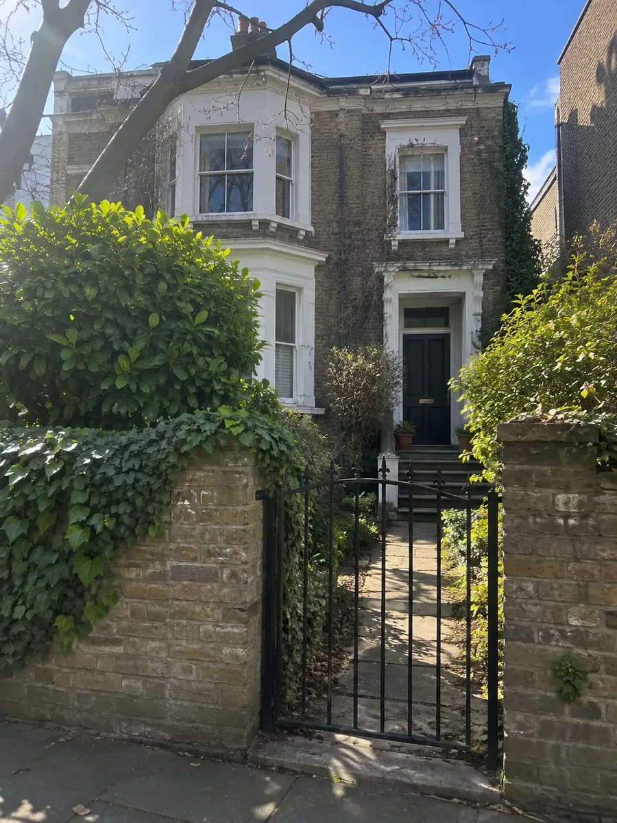 Townhouse behind a garden gate
